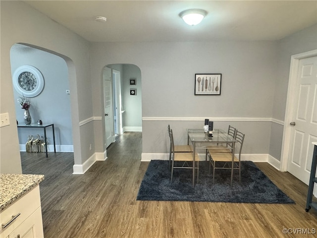 dining area featuring dark hardwood / wood-style flooring