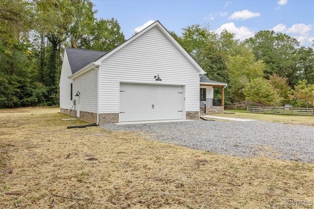 view of side of property featuring a garage