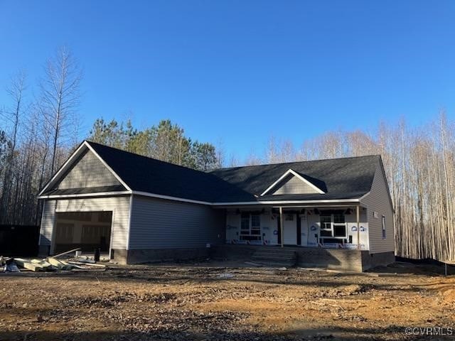 view of front of home featuring a garage and covered porch