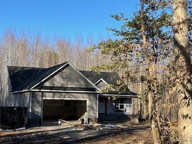 property under construction with a garage and central air condition unit