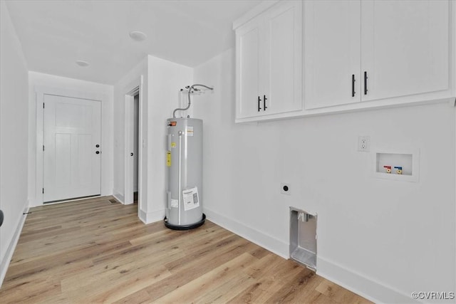 laundry area with baseboards, washer hookup, water heater, cabinet space, and electric dryer hookup