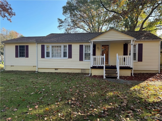 view of front facade featuring a front lawn and covered porch