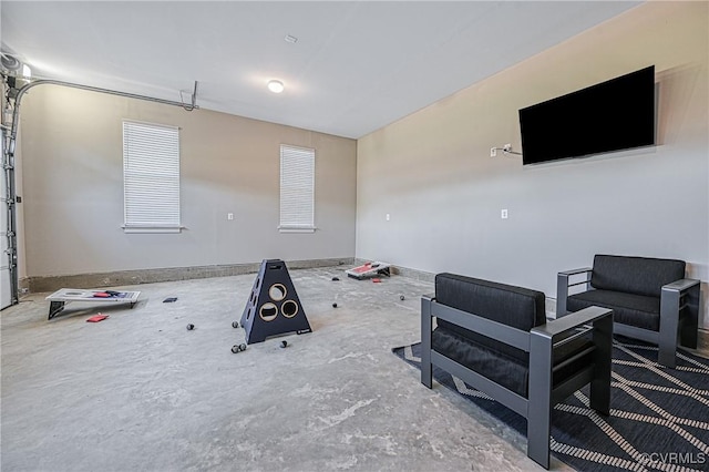 living room featuring concrete flooring