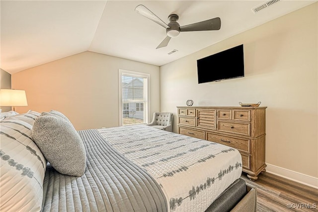 bedroom featuring lofted ceiling, ceiling fan, and dark wood-type flooring