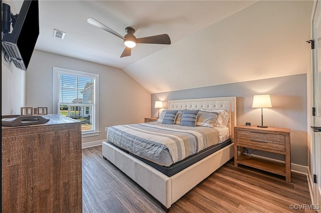 bedroom featuring ceiling fan, lofted ceiling, and dark wood-type flooring