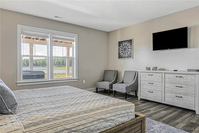 bedroom featuring dark hardwood / wood-style flooring