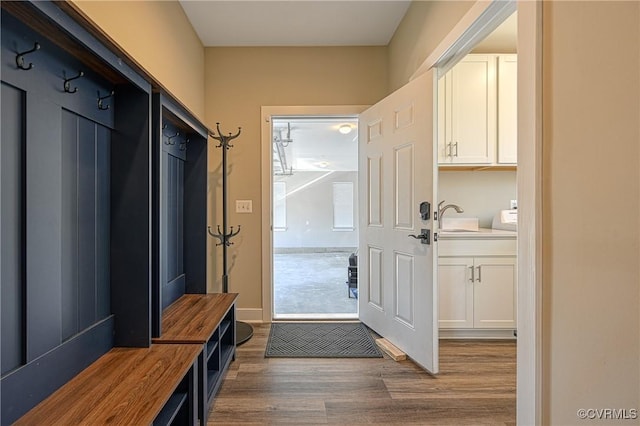 mudroom featuring dark hardwood / wood-style floors and sink