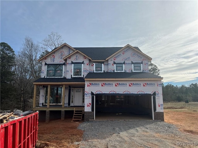 property under construction featuring gravel driveway