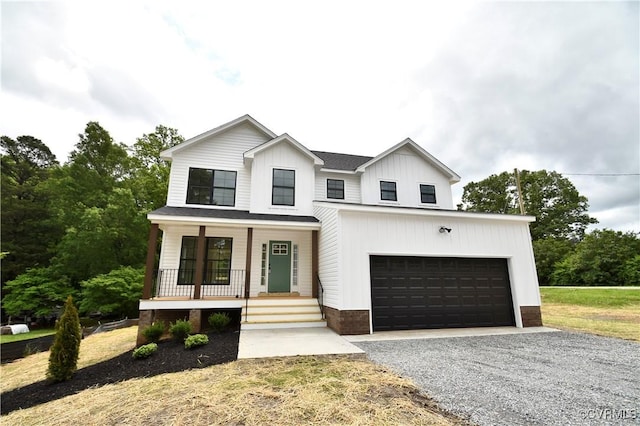 16159 W Patrick Henry Rd, Montpelier, VA 23192 - modern inspired farmhouse featuring a porch, driveway, board and batten siding, and a garage