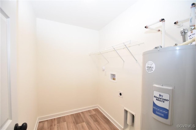 16159 W Patrick Henry Rd, Montpelier, VA 23192 - laundry area featuring water heater, washer hookup, light wood-type flooring, baseboards, and electric dryer hookup