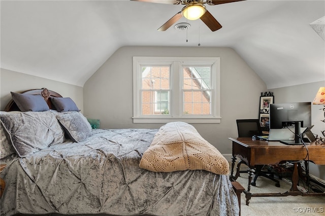 bedroom with carpet flooring, vaulted ceiling, and ceiling fan