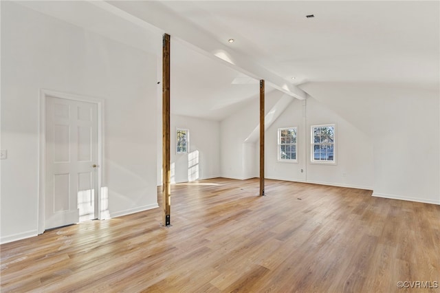 bonus room with vaulted ceiling with beams and light hardwood / wood-style floors