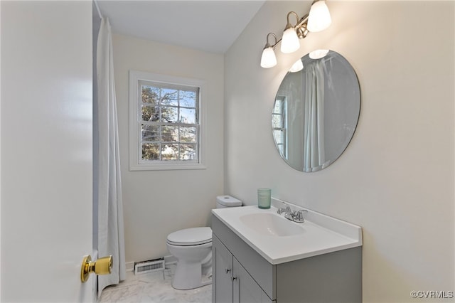 bathroom with vanity and toilet