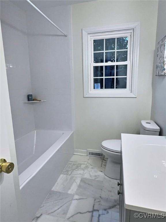 full bathroom with vanity,  shower combination, and toilet