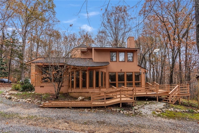 rear view of property with a deck