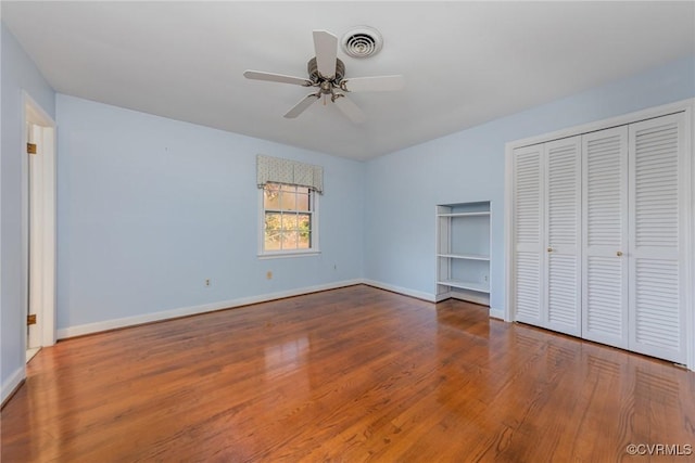 unfurnished bedroom with hardwood / wood-style floors and ceiling fan