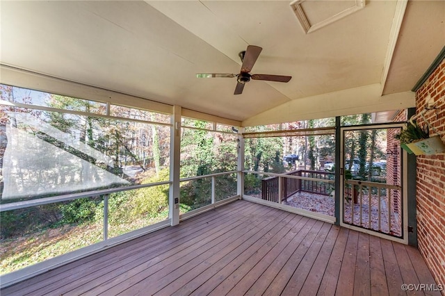 unfurnished sunroom with lofted ceiling and ceiling fan