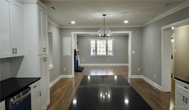 kitchen with dishwasher, decorative light fixtures, dark hardwood / wood-style flooring, white cabinetry, and a chandelier