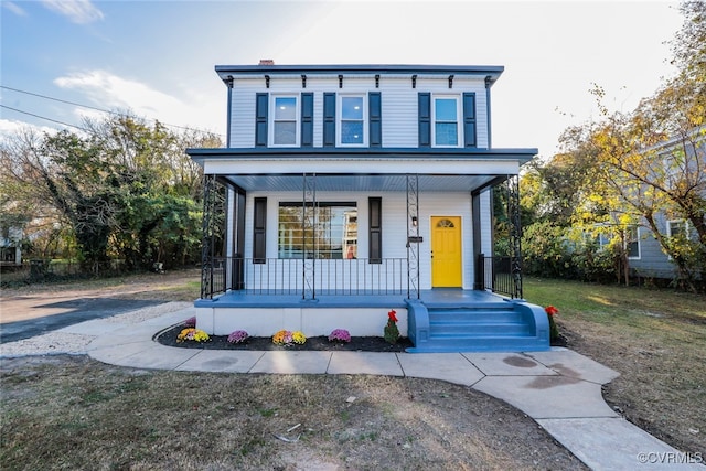 italianate-style house with covered porch