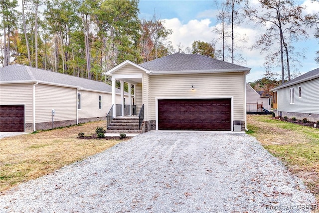 view of front facade with a front yard and a garage