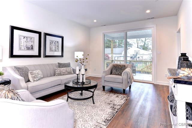 living room featuring dark hardwood / wood-style flooring