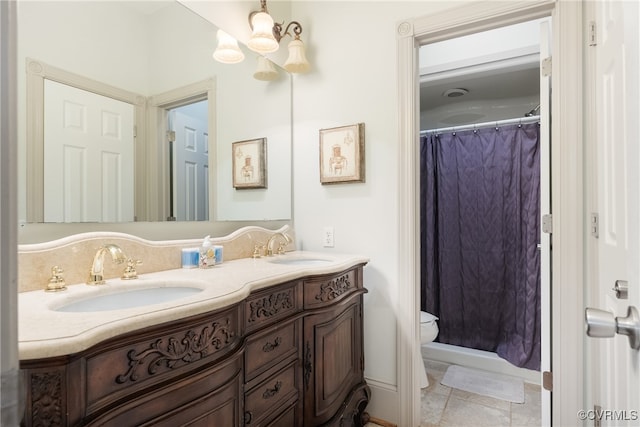 bathroom with vanity, tile patterned flooring, and toilet