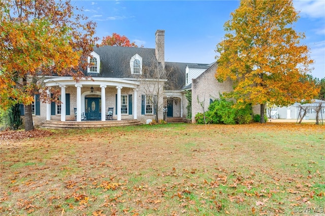 rear view of property with a patio and a yard