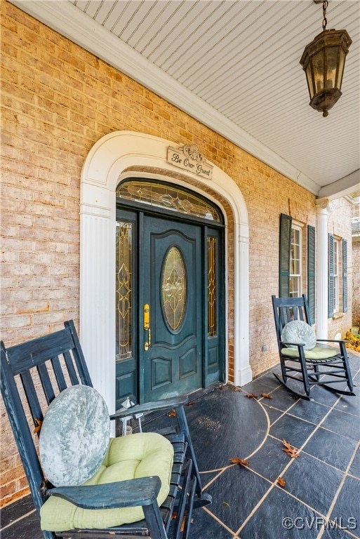 doorway to property featuring covered porch