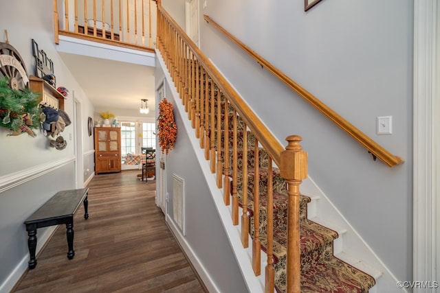 stairs featuring wood-type flooring