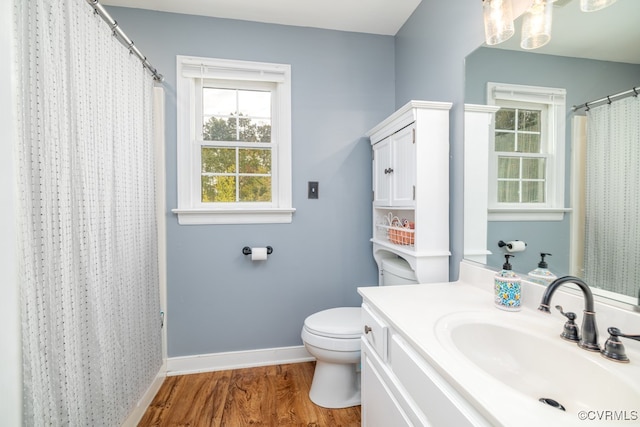 bathroom featuring toilet, a shower with curtain, vanity, and wood-type flooring