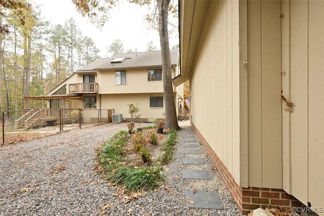 view of side of home featuring central air condition unit