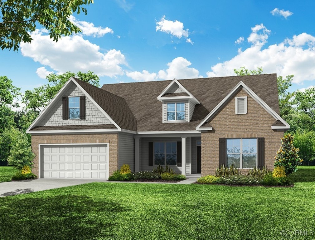 view of front of home featuring a front lawn and a garage