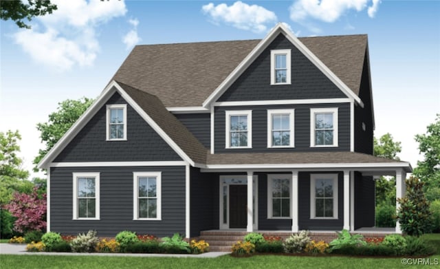 view of front of house with a front yard and covered porch