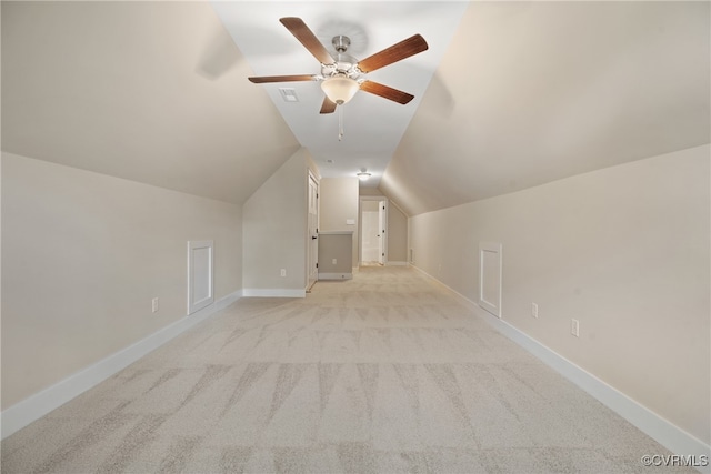 bonus room with light carpet, ceiling fan, and vaulted ceiling