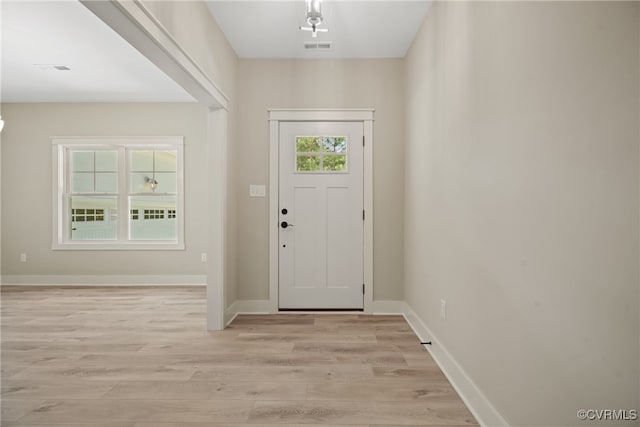 foyer entrance featuring plenty of natural light and light hardwood / wood-style floors