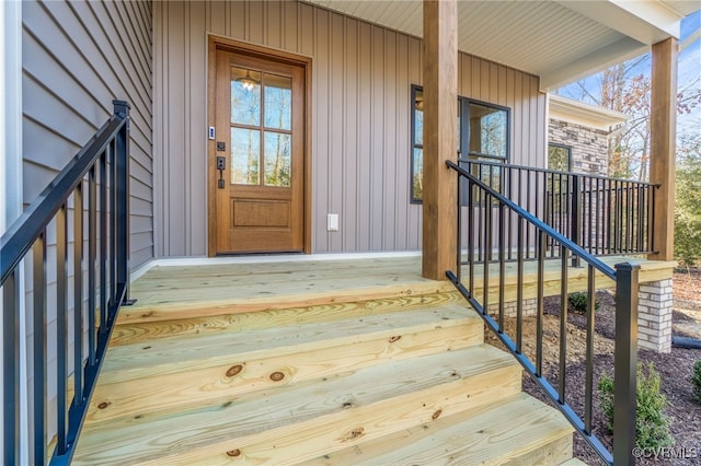 view of exterior entry featuring a porch