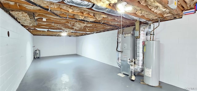 basement featuring water heater and heating unit