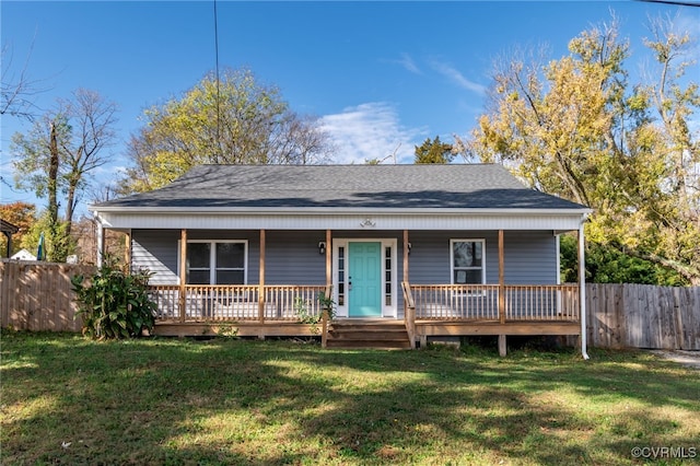 view of front of property with a porch and a front lawn