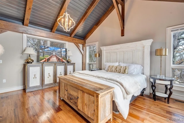 bedroom with wooden ceiling, high vaulted ceiling, light hardwood / wood-style flooring, beamed ceiling, and a chandelier