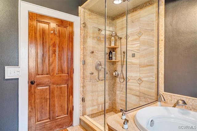 bathroom with sink, a textured ceiling, and shower with separate bathtub