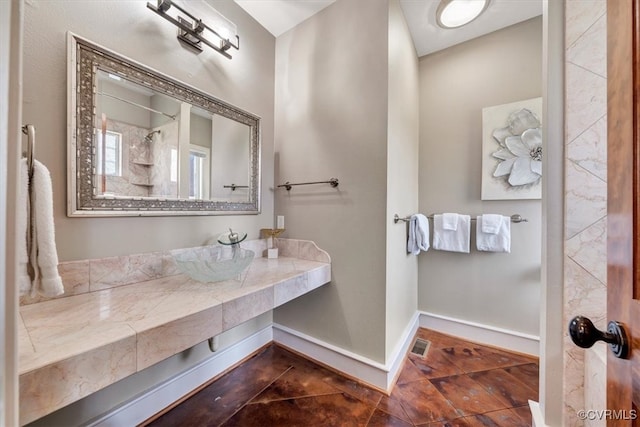 bathroom with sink and walk in shower