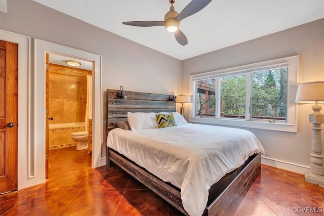 tiled bedroom featuring connected bathroom and ceiling fan