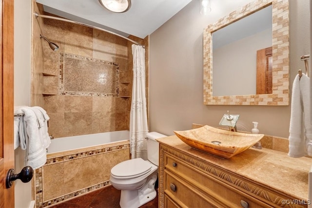 full bathroom featuring toilet, vanity, tile patterned floors, and shower / tub combo with curtain