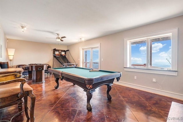 rec room with dark tile patterned floors, ceiling fan, and billiards