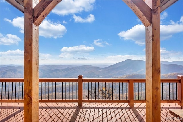 wooden terrace with a mountain view