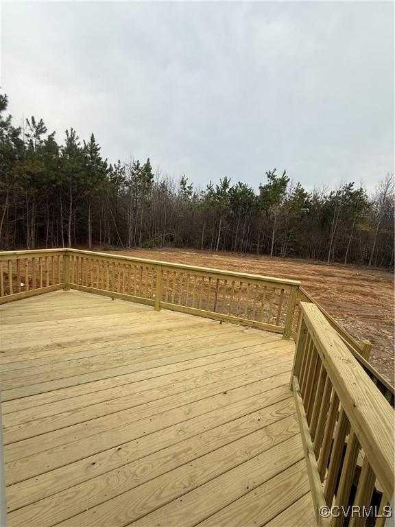 wooden terrace with a forest view