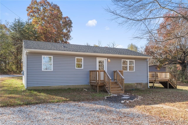 view of front of house with a wooden deck