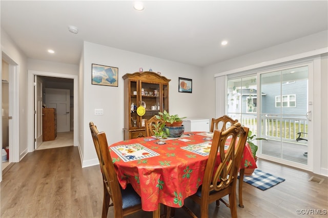 dining area featuring hardwood / wood-style floors