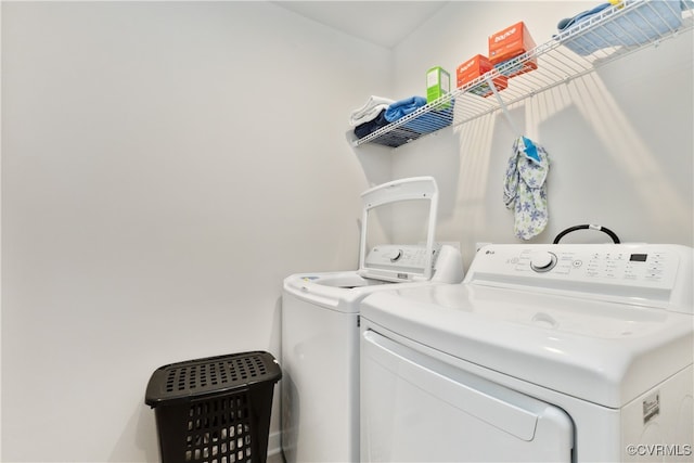 laundry room featuring separate washer and dryer