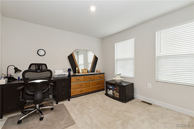 carpeted home office with a wealth of natural light